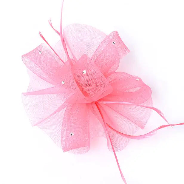 Hot pink net fascinator on a clip