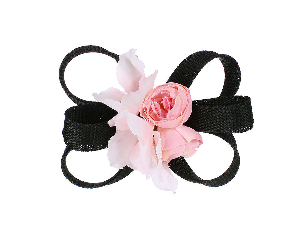 Pink flower with black bow fascinator